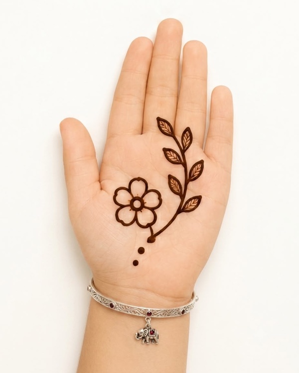 Flower with leafy branch mehndi design for kids palm with bloom and elegant trailing leaves, nature henna for beginners
